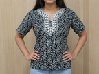 Vastraanii Women's Black Floral Printed Cotton Top with Embroidered Neck
