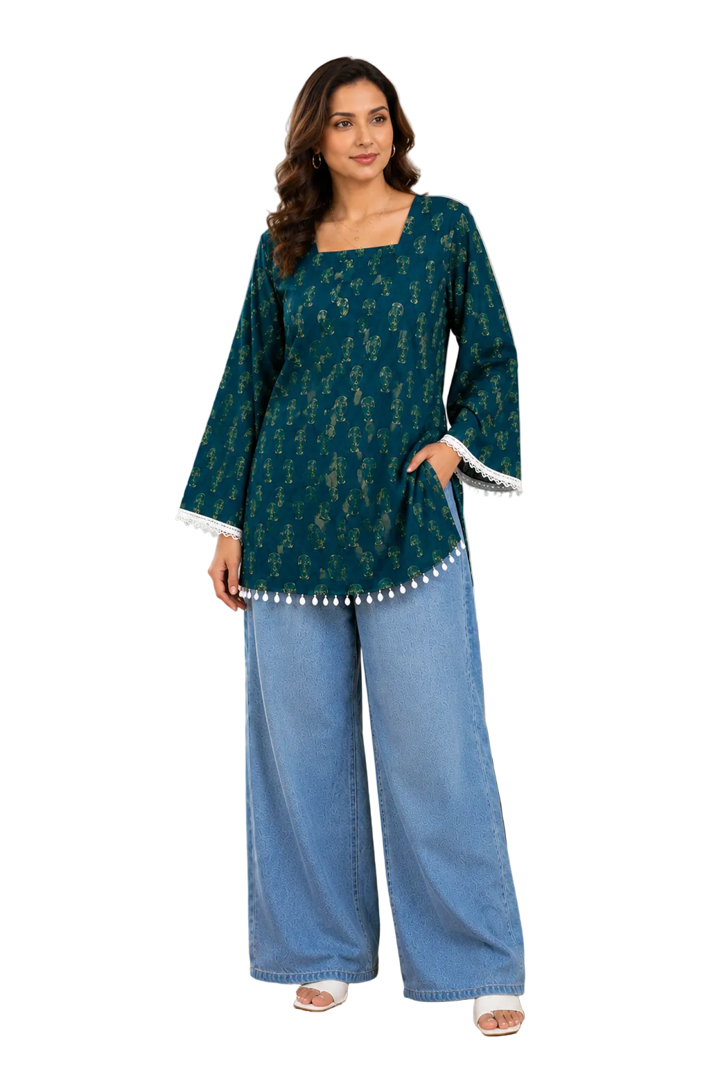 A woman modeling a dark teal printed kurta with white pom-pom trim and wide-leg blue jeans, standing in a bright, modern living room. An 'XL SIZE' label is visible in the top-left corner.