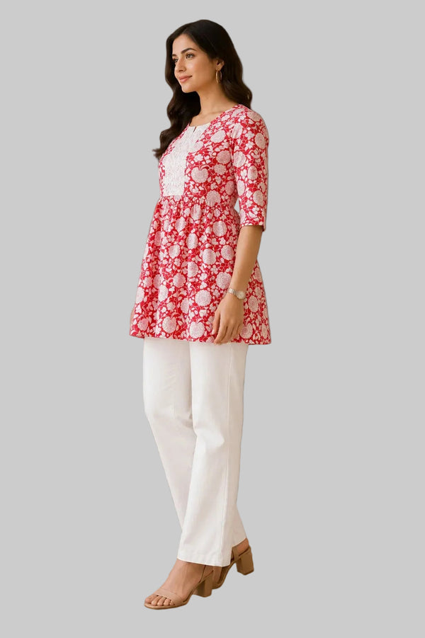 Vastraanii Women's Red Floral Cotton Peplum Kurti with White Lace Yoke & Tie-Up Back